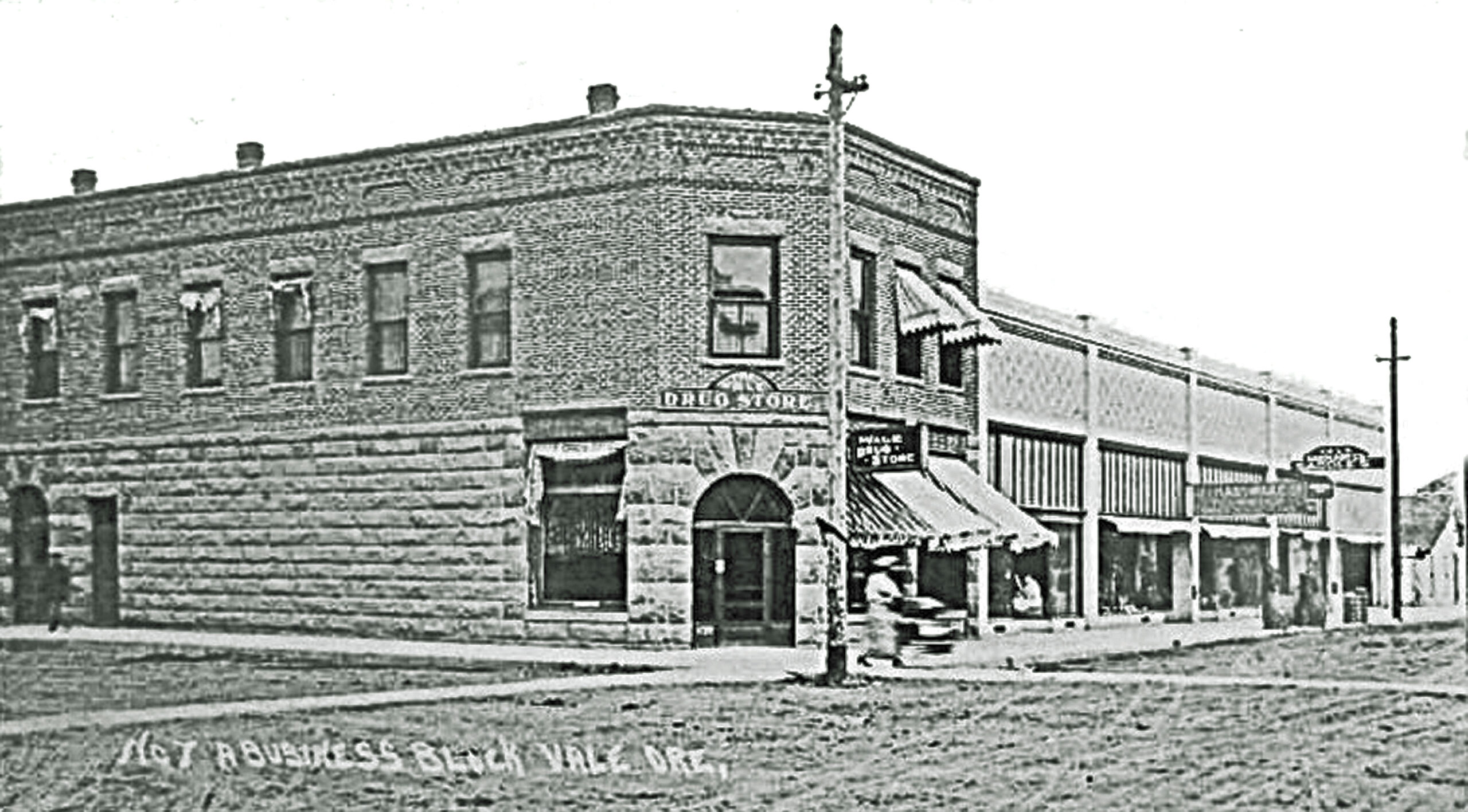 drug store hardware store, and a saddle shop BW